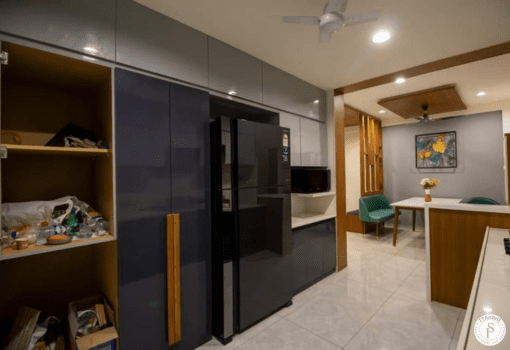 Modern kitchen interior design and wooden panel by Itakshii Designs Pune